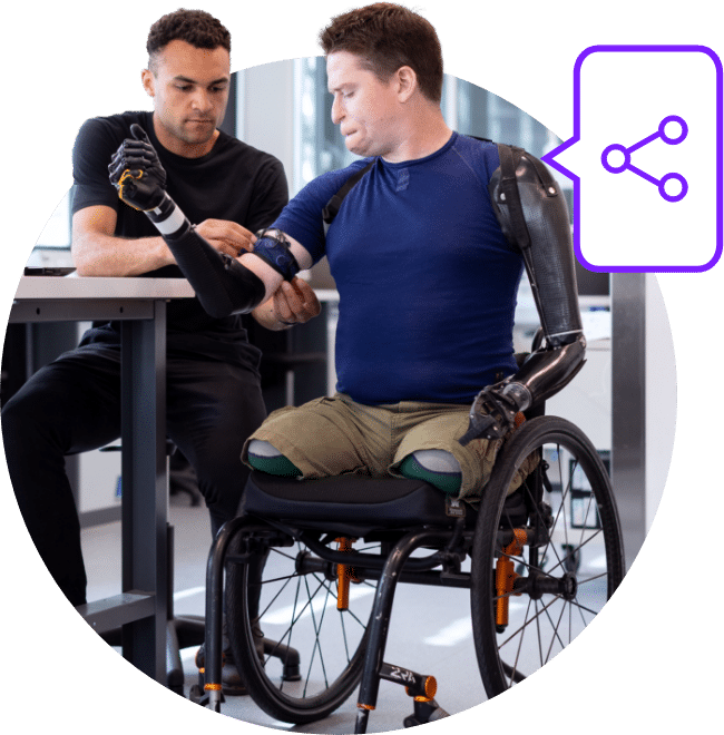 Man in wheelchair with physio
